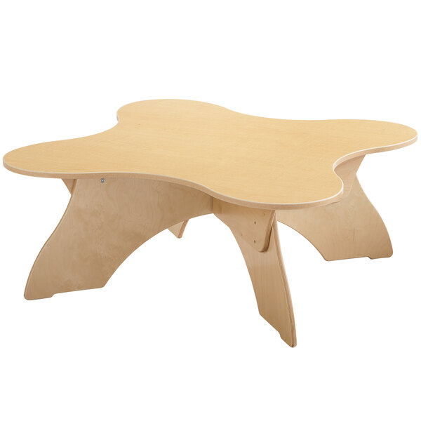 A Jonti-Craft birch table with a flower shaped top.