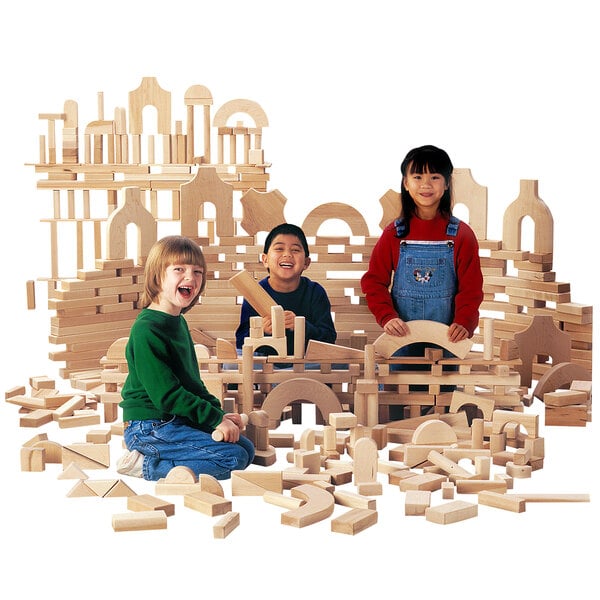 three children playing with interlocking blocks