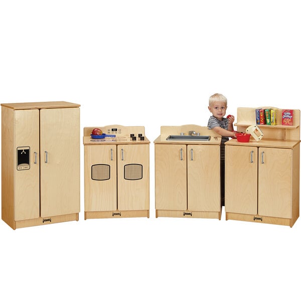 A Jonti-Craft wooden play kitchen set with a sink and stove on a counter.