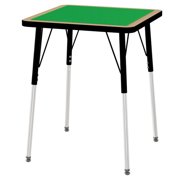 A green rectangular Jonti-Craft brick building table with legs.