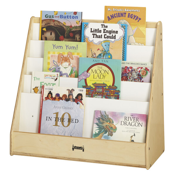 A Jonti-Craft wooden book rack with books on it.