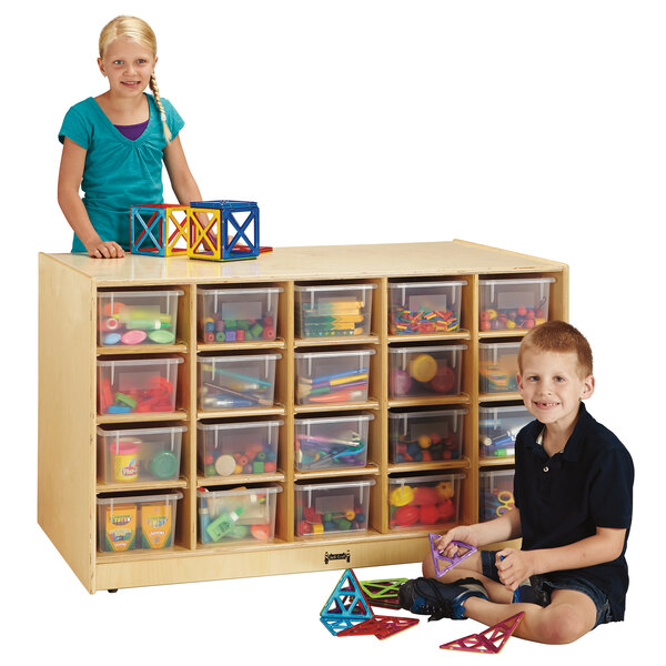 A boy and a girl playing with toys at a Jonti-Craft mobile wood storage island.