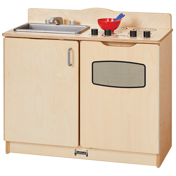 A Jonti-Craft wooden play kitchen with a sink and stove.