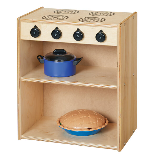 A Young Time natural wood toy kitchen stove with a blue pot and pie on it.