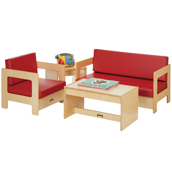 A Jonti-Craft children's wood living room set with red cushions on the chairs.