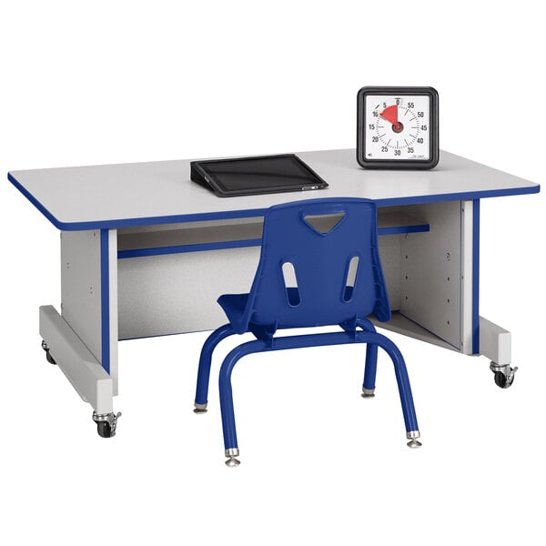 A blue Rainbow Accents adjustable height computer desk with a chair on wheels.