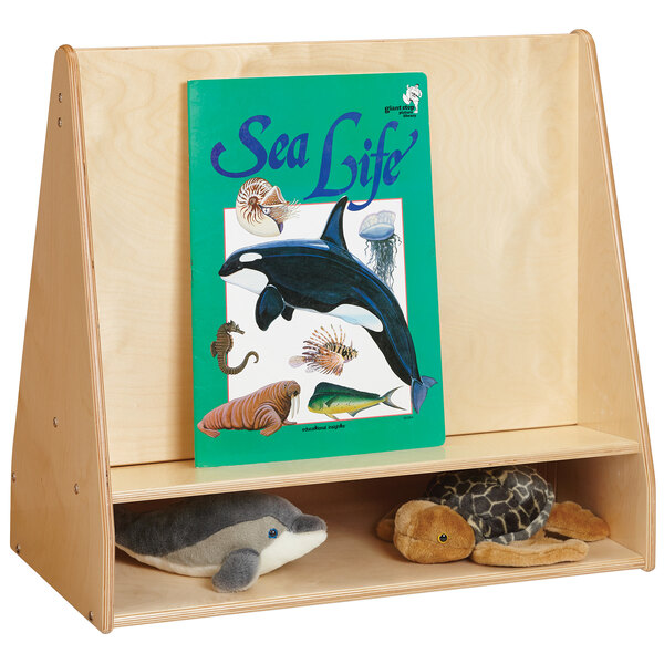 A Jonti-Craft open back wood pick-a-book stand with a book cover with a whale and sea animals on display.