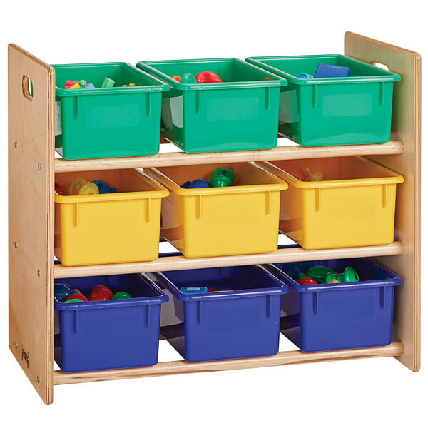 A Jonti-Craft wooden cubbie tray storage rack with green, blue, and yellow bins holding toys.