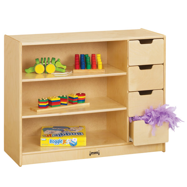 A Jonti-Craft wooden storage module with drawers filled with toys.