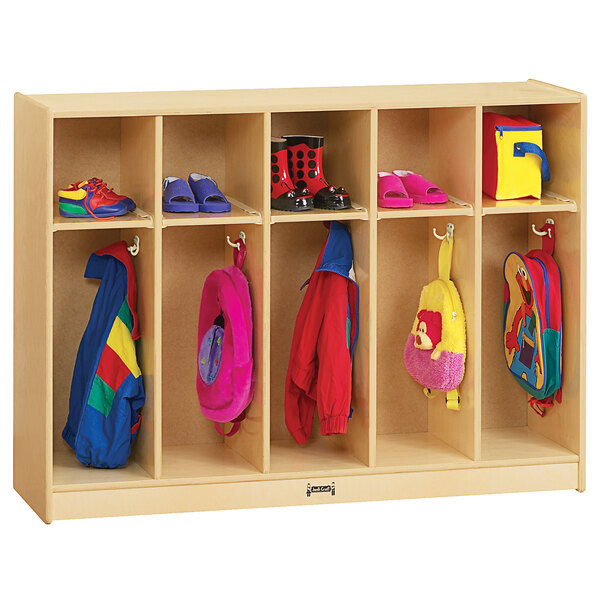 A Jonti-Craft toddler-height wooden locker with coats and bags inside.