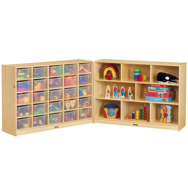 a wooden storage cabinet with many toys