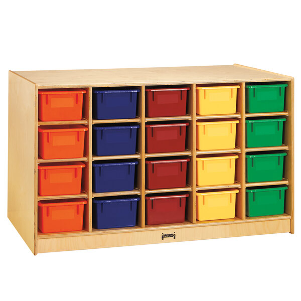 A Jonti-Craft wooden storage island with many small colored bins on each side.