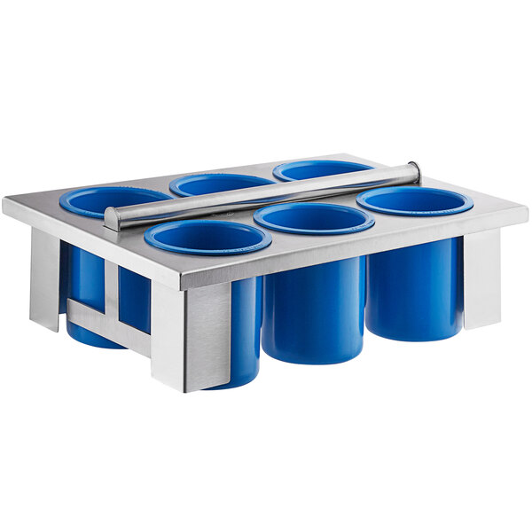 A Steril-Sil stainless steel flatware basket with blue solid cylinders inside.