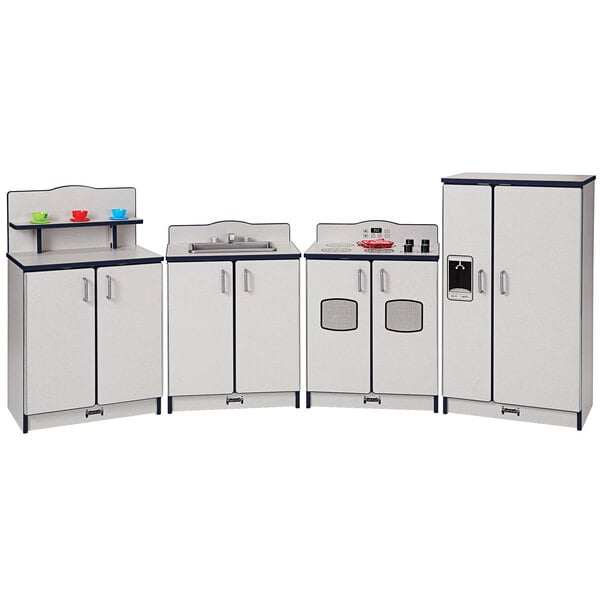 A navy kitchen set with white and gray accents including a refrigerator, sink, and stove.