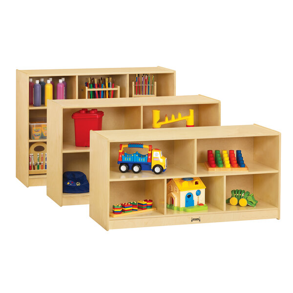 A Jonti-Craft wooden storage cabinet with toys on wooden shelves.