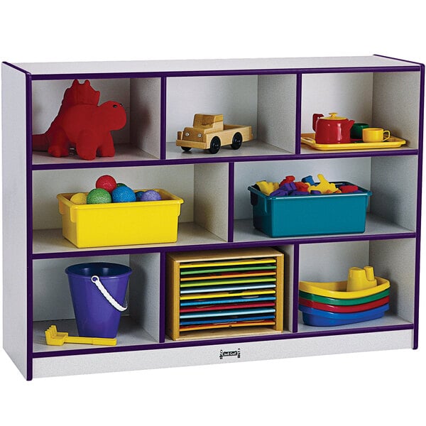 A Rainbow Accents purple and white storage cabinet with toys on the shelves.