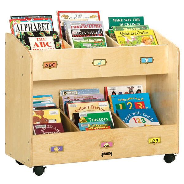 A Jonti-Craft wooden book organizer on wheels filled with books.