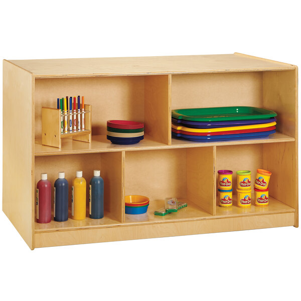 A Jonti-Craft double-sided wooden storage island with colored trays on shelves.