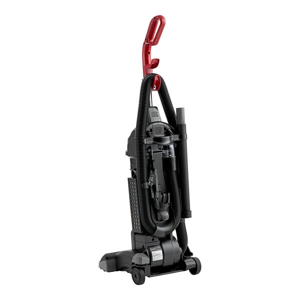 A black and red Sanitaire upright vacuum cleaner on wheels.