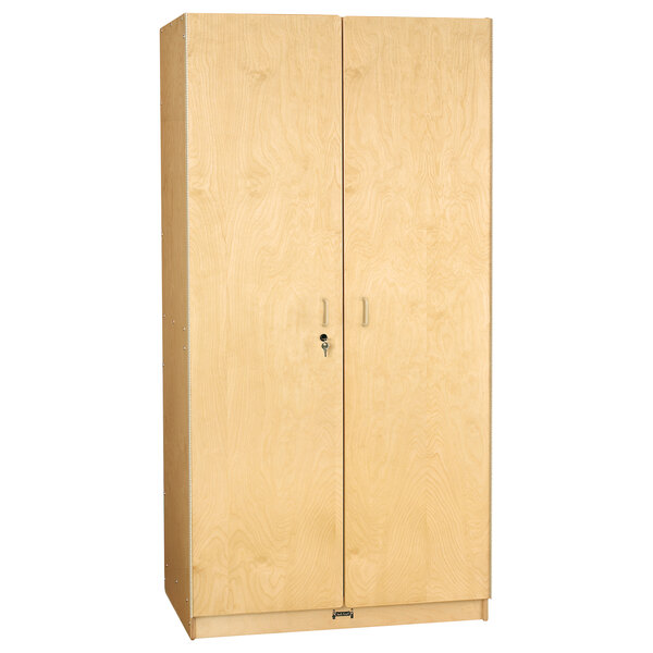 A Jonti-Craft Baltic Birch wooden cabinet with two doors and a lock.