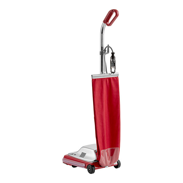 A red and silver Sanitaire TRADITION upright vacuum cleaner.