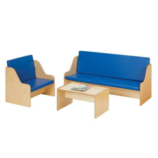 A natural wooden Young Time living room set with blue padded seating including a couch and table.