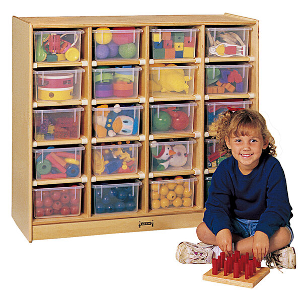 A child sitting next to a Jonti-Craft mobile wood storage cabinet with clear plastic bins.