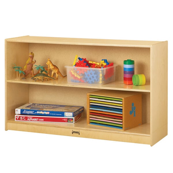 A Jonti-Craft wooden storage cabinet with open shelves holding toys and books.