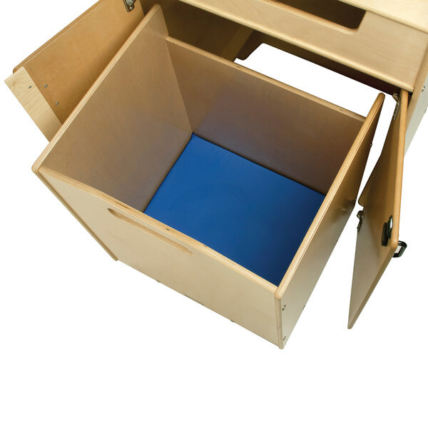 A Jonti-Craft wooden book return cart with open shelves.