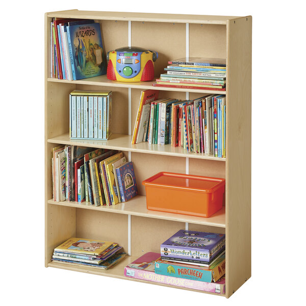 A Young Time natural bookcase full of books and toys.