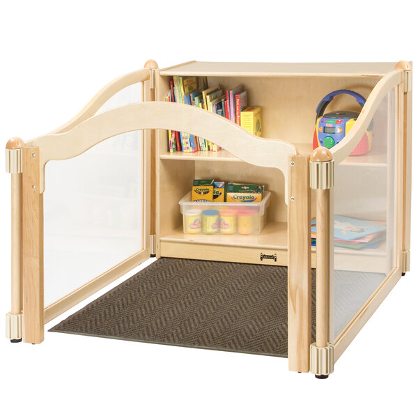 A wooden Imagination Nook with storage filled with books and toys.