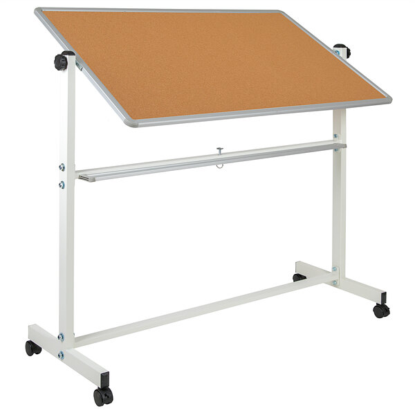 A white metal stand with a cork bulletin board on it.