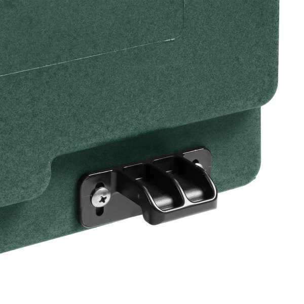A close-up of a green box with a latch.