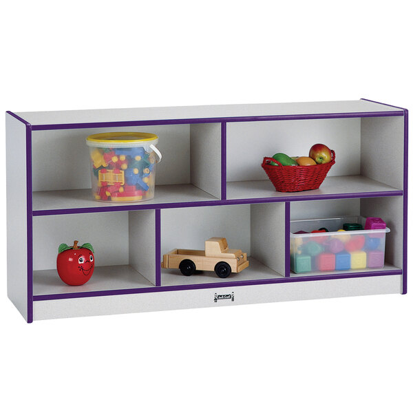 A white and purple Rainbow Accents toddler-height storage cabinet with toys.
