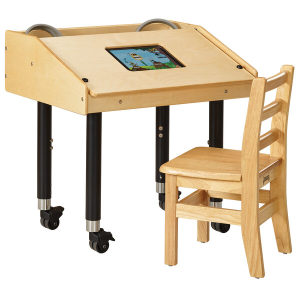 a wooden desk with a screen on it