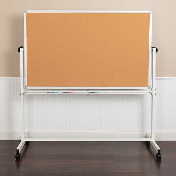 A Flash Furniture reversible cork and whiteboard on a stand.