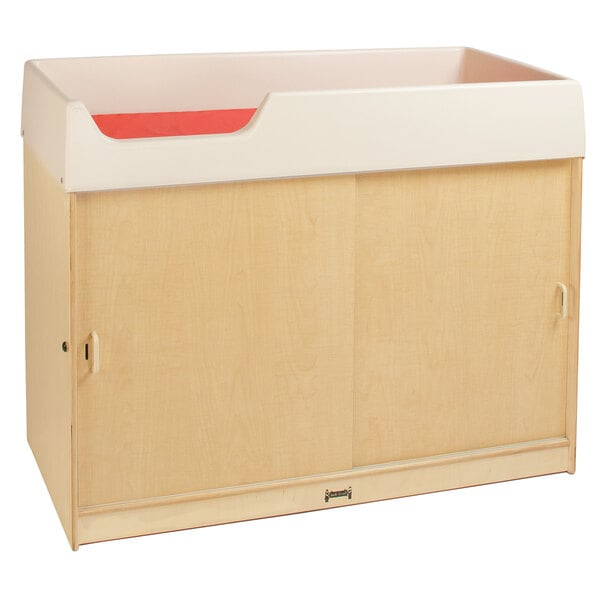 A wooden Jonti-Craft baby changing cabinet with lockable undershelf storage.
