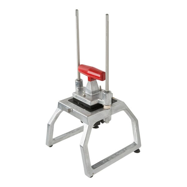 A tabletop-mounted fruit and vegetable corer with a red handle and metal frame, designed to cut produce into 8 sections.