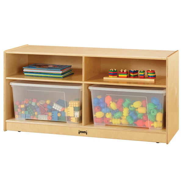 A Jonti-Craft wooden storage cabinet with plastic bins full of toys.