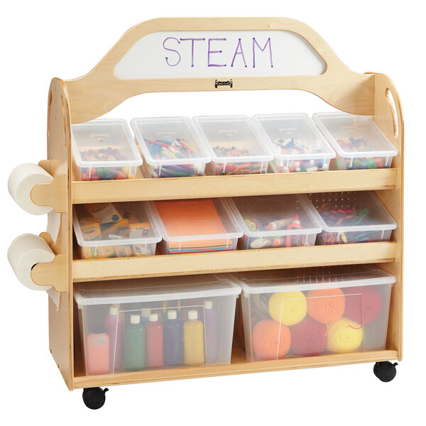 A Jonti-Craft wood multimedia supply cart with 3 shelves and plastic containers with colorful objects inside.