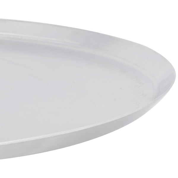 An American Metalcraft heavy weight aluminum pizza pan with a circular rim.