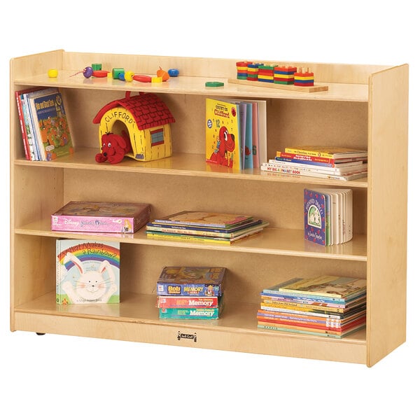 A Jonti-Craft wooden storage cabinet with books and toys on the shelves.