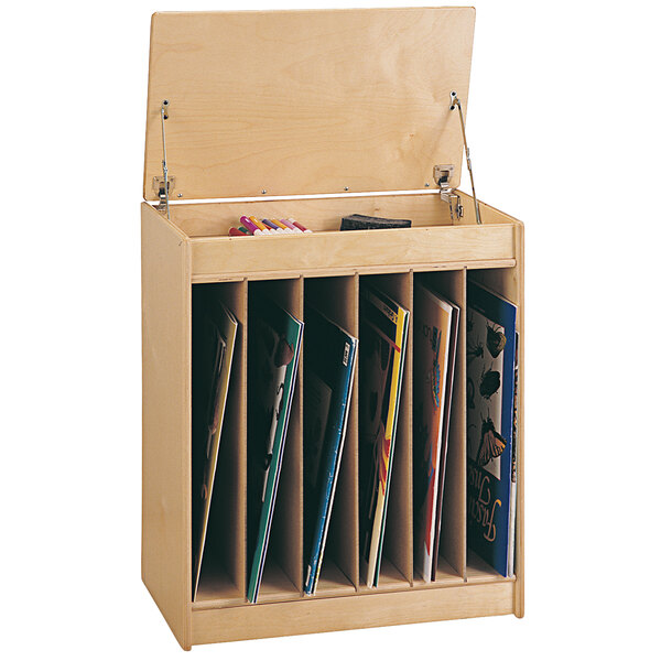 A Jonti-Craft Big Book Easel with books on it.