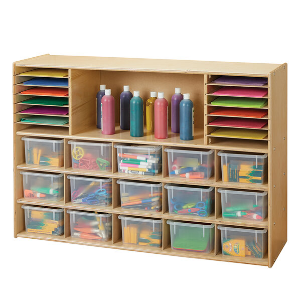 A Young Time natural wooden sectional cubbie storage unit with clear plastic bins.