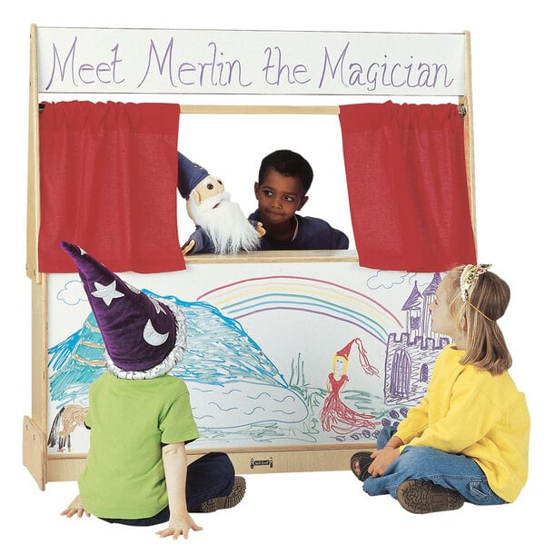 A group of kids playing with a Jonti-Craft Write-n-Wipe Imagination Station puppet show.