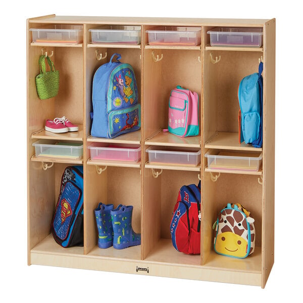 A Jonti-Craft wooden take-home center with clear plastic paper trays holding blue, pink, and giraffe print bags and backpacks.