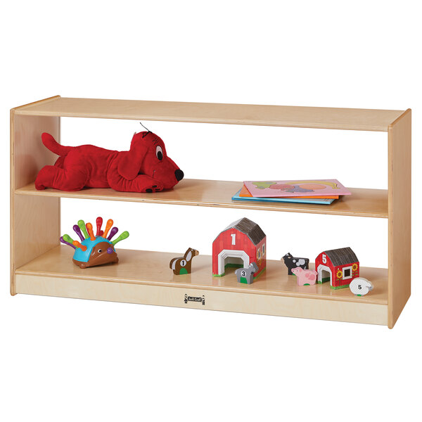 A Jonti-Craft wooden toddler shelf with toys on it.