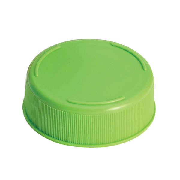 A close-up of a Tablecraft light green plastic lid for squeeze bottles with a 63 mm opening.