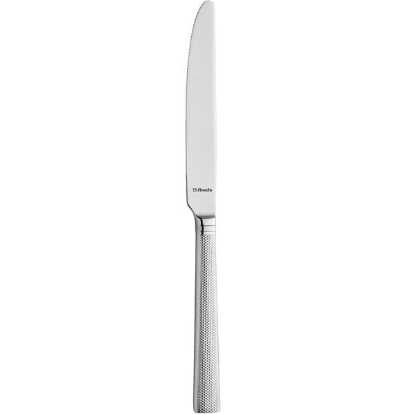 An Amefa stainless steel table knife with a white handle.