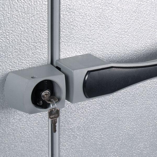 The right hinged door with a black handle on a Kolpak indoor walk-in cooler.